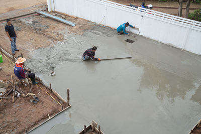 High angle view of people working in water