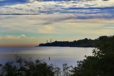 View of calm sea against cloudy sky