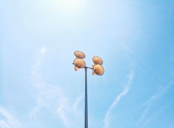 Low angle view of balloons against blue sky
