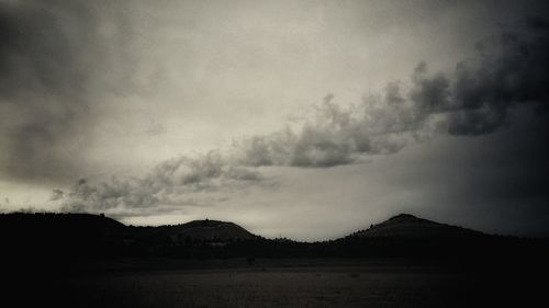 Scenic view of silhouette mountain against sky