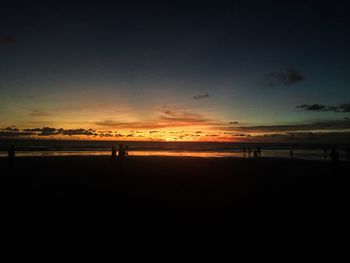 Scenic view of beach against sky during sunset