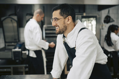 Side view of man working at clinic