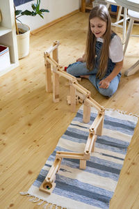 Young woman sitting on table