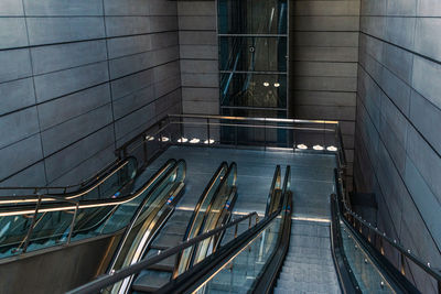 Escalators on amagerbro station leading down to a metro subway in copenhagen, denmark