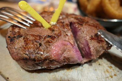 Close-up of meat on barbecue grill