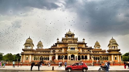 People in front of historical building