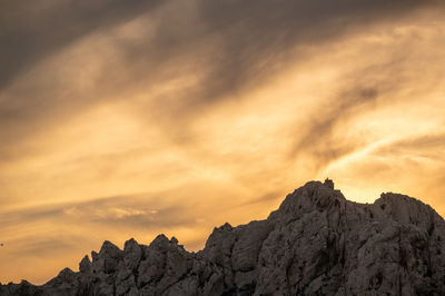 Low angle view of mountain against sky during sunset