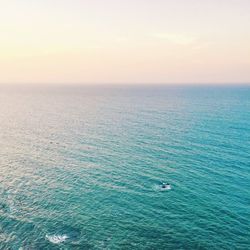 Scenic view of calm sea at sunset