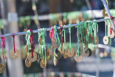 Close-up of clothespins hanging on clothesline