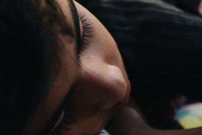 Close-up of teenage boy sleeping at home