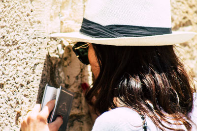 Rear view of woman using mobile phone