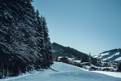 Snow covered mountain against clear blue sky