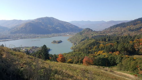 Scenic view of landscape and mountains against sky