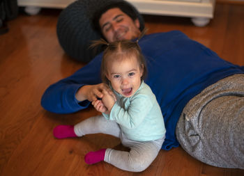 Portrait of mother and daughter at home