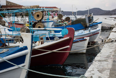 Fishing boats moored at harbor