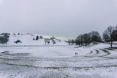 Scenic view of snow field against clear sky