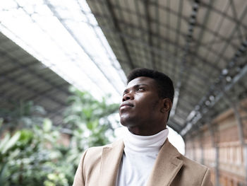 Low angle view of man looking away