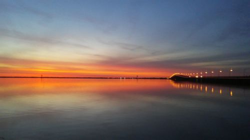 Scenic view of sea against sky at sunset