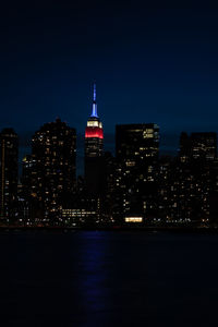 Illuminated buildings in city at night
