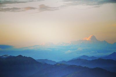 Scenic view of mountains against sky during sunset