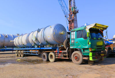 View of construction site against clear blue sky