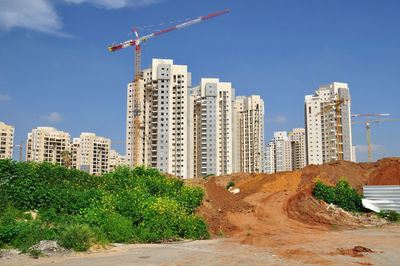 Modern buildings against sky in city