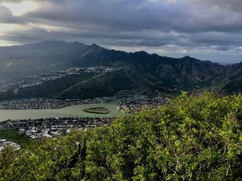 Scenic view of lake and mountains against sky