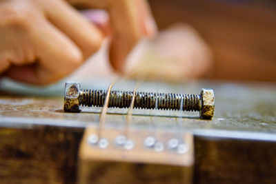 Close-up of hand holding wood