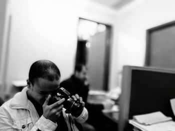 Man photographing in medical clinic