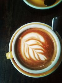 High angle view of cappuccino on table