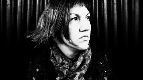 Portrait of young woman looking away