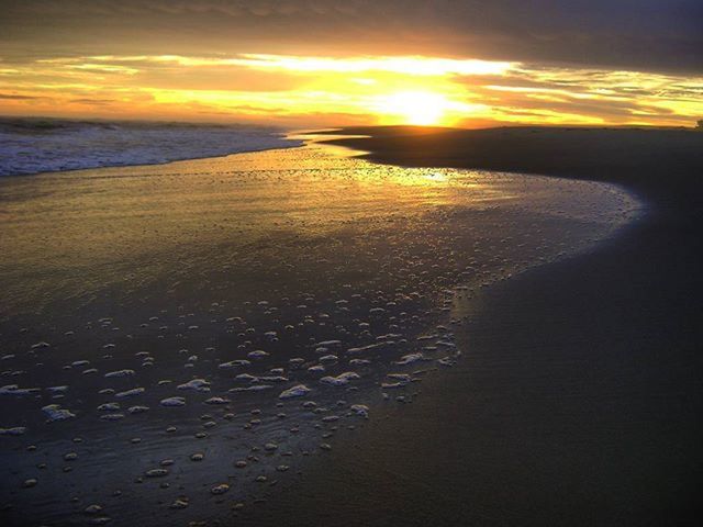 sunset, sea, water, beach, sky, horizon over water, scenics, beauty in nature, orange color, tranquil scene, sun, tranquility, cloud - sky, shore, nature, reflection, idyllic, sand, sunlight, cloud