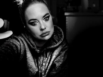 Portrait of beautiful young woman at home