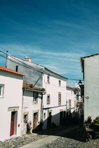 Buildings in city against sky