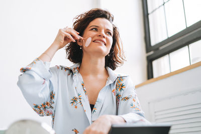 Young woman using mobile phone