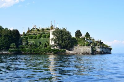 Low angle view of castle by lake maggiore
