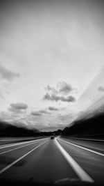 Highway seen through car windshield