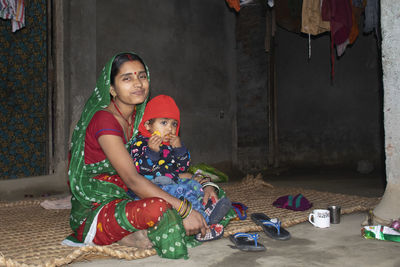 Portrait of a girl sitting on floor