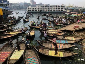 Boats moored at harbor