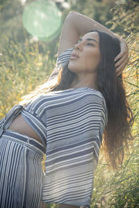 Stylish latina woman in fields and afternoon light