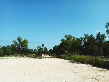 Scenic view of land against clear blue sky