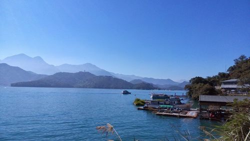 Scenic view of sea against clear blue sky