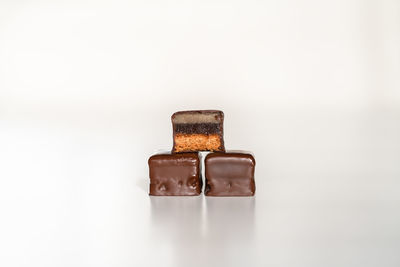 Close-up of chocolate cake against white background