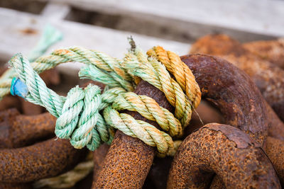 Rope tied on rusty metal