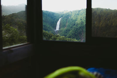 Scenic view of mountains seen through window