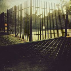 Road seen through chainlink fence