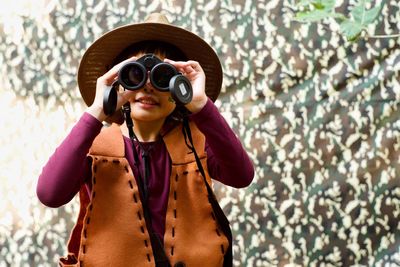 Girl looking through binoculars