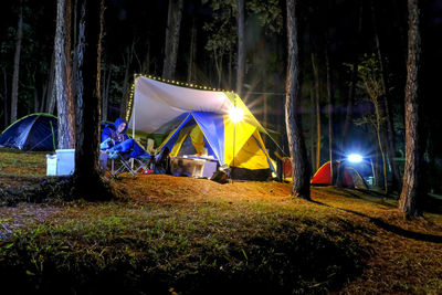 View of tent in field at night