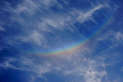 Low angle view of rainbow in sky