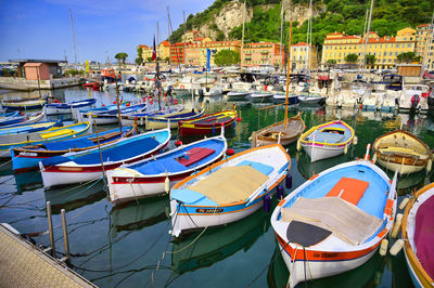 High angle view of boats moored at harbor